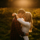 engagement images with backlight in a field love