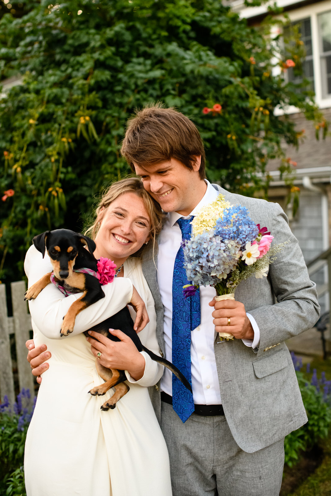 bride and groom with dog Micro wedding woods hole