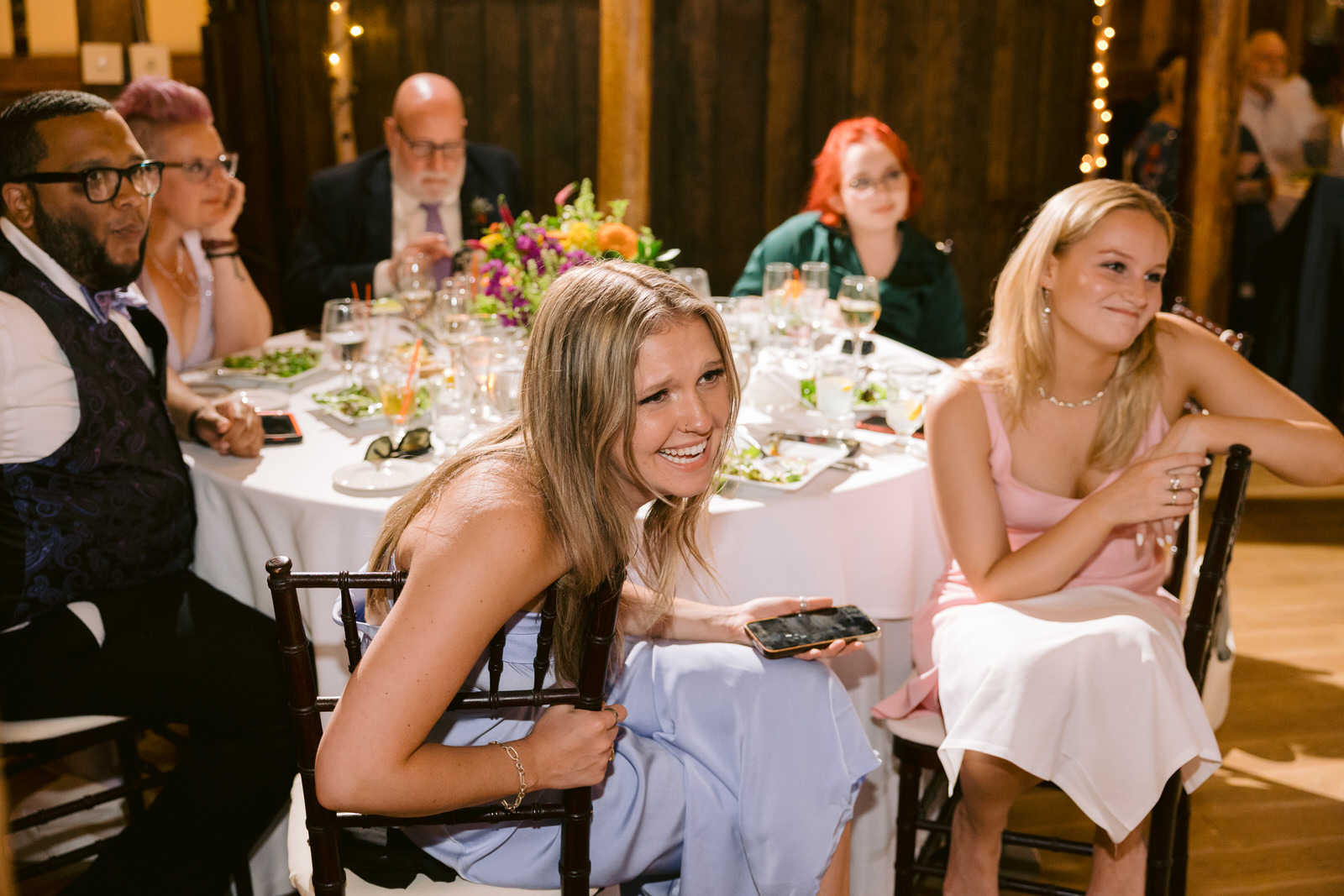 guests laughing during speeches round barn vt wedding