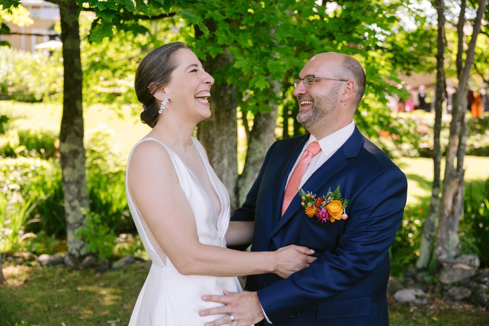 bride and groom laughing round barn vt wedding