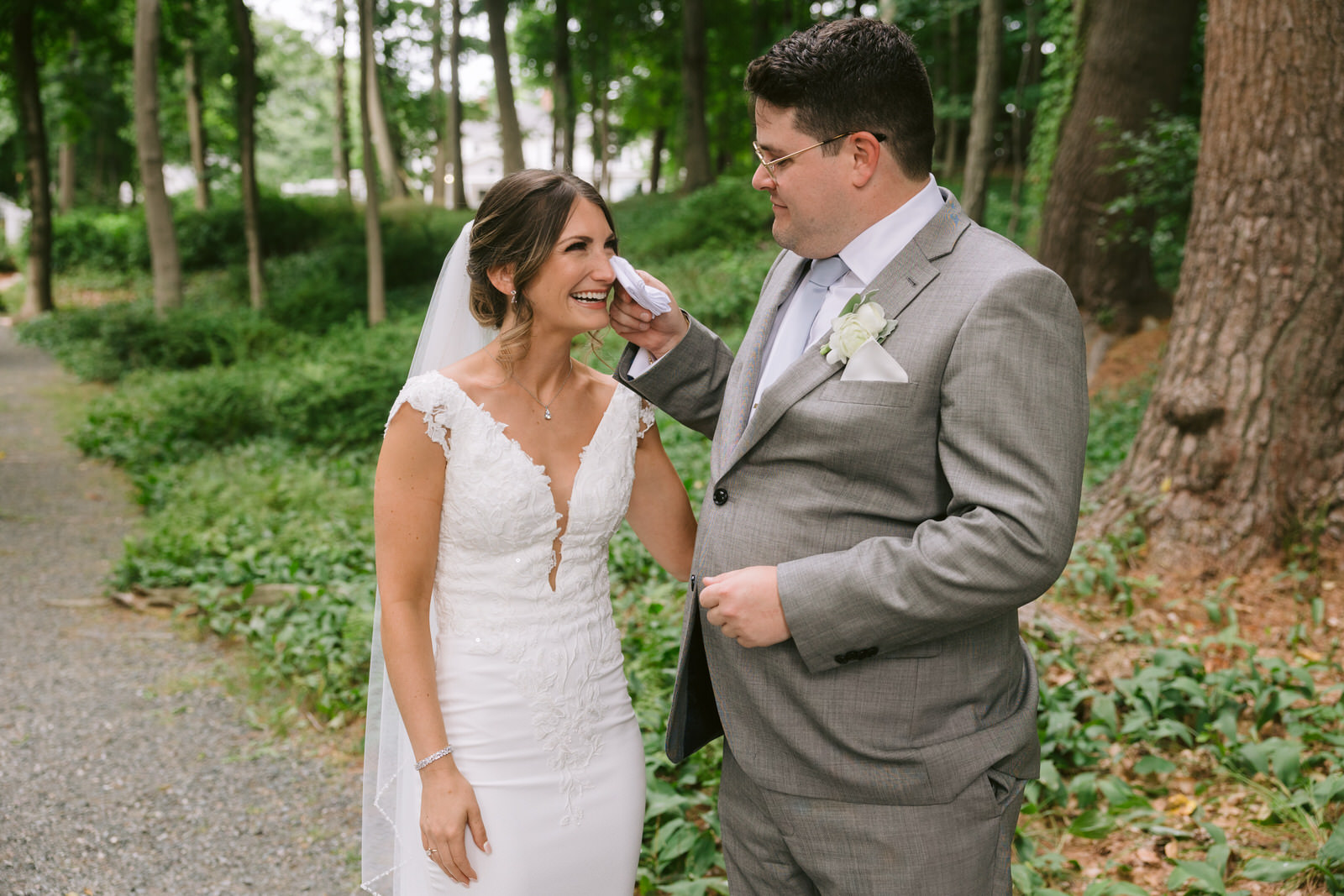 groom wiping brides tears saphire estate wedding