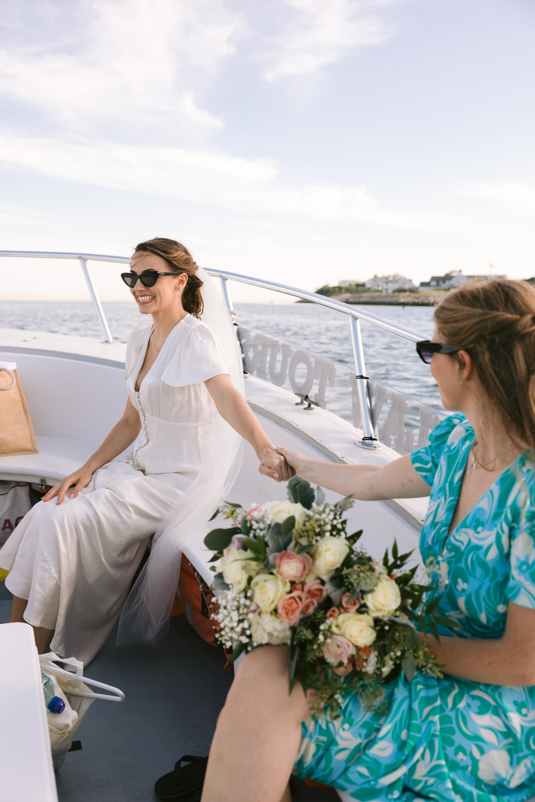 bride on boat to north beach island elopement
